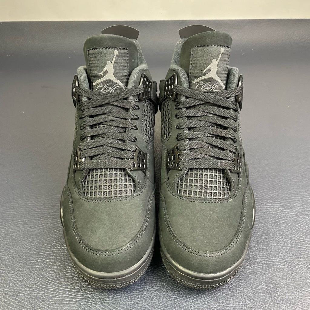 Air Jordan 4 Black Cat - front toe box pair view showing Flight tongue and mesh panels