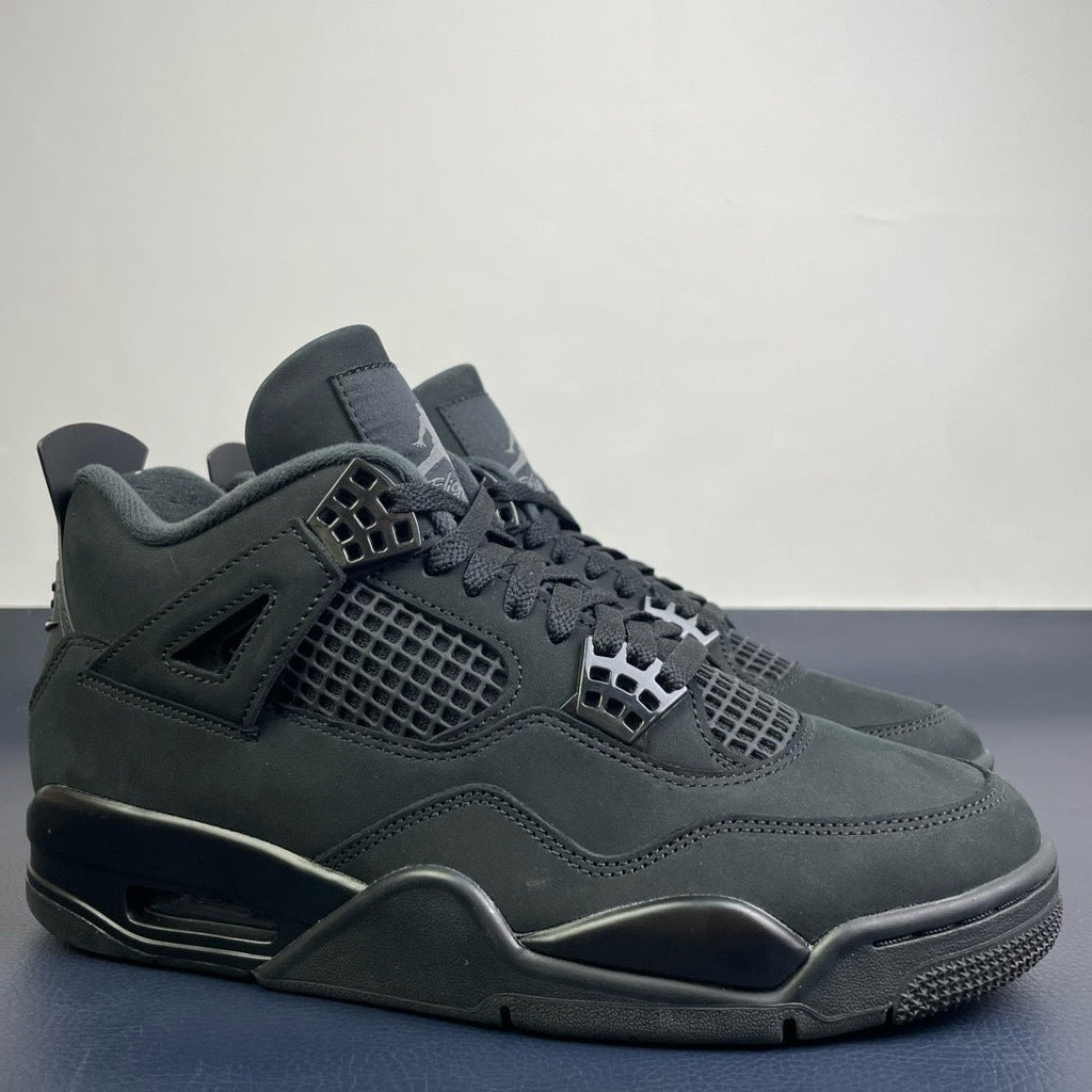 Air Jordan 4 Black Cat - side profile pair view showing nubuck upper and Air unit