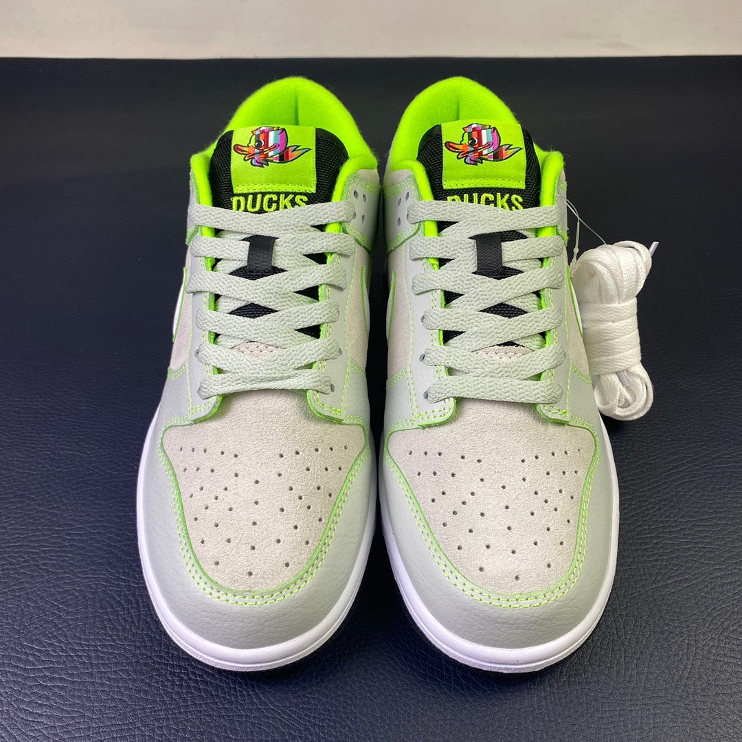 Nike Dunk Low Oregon Ducks - toe view pair showing DUCKS tongue branding and mascot graphic