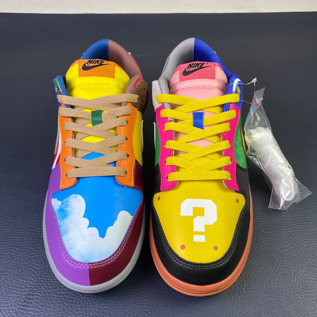 Nike Dunk Low What The Mario - toe view pair showing Luigi L badge and Question Block