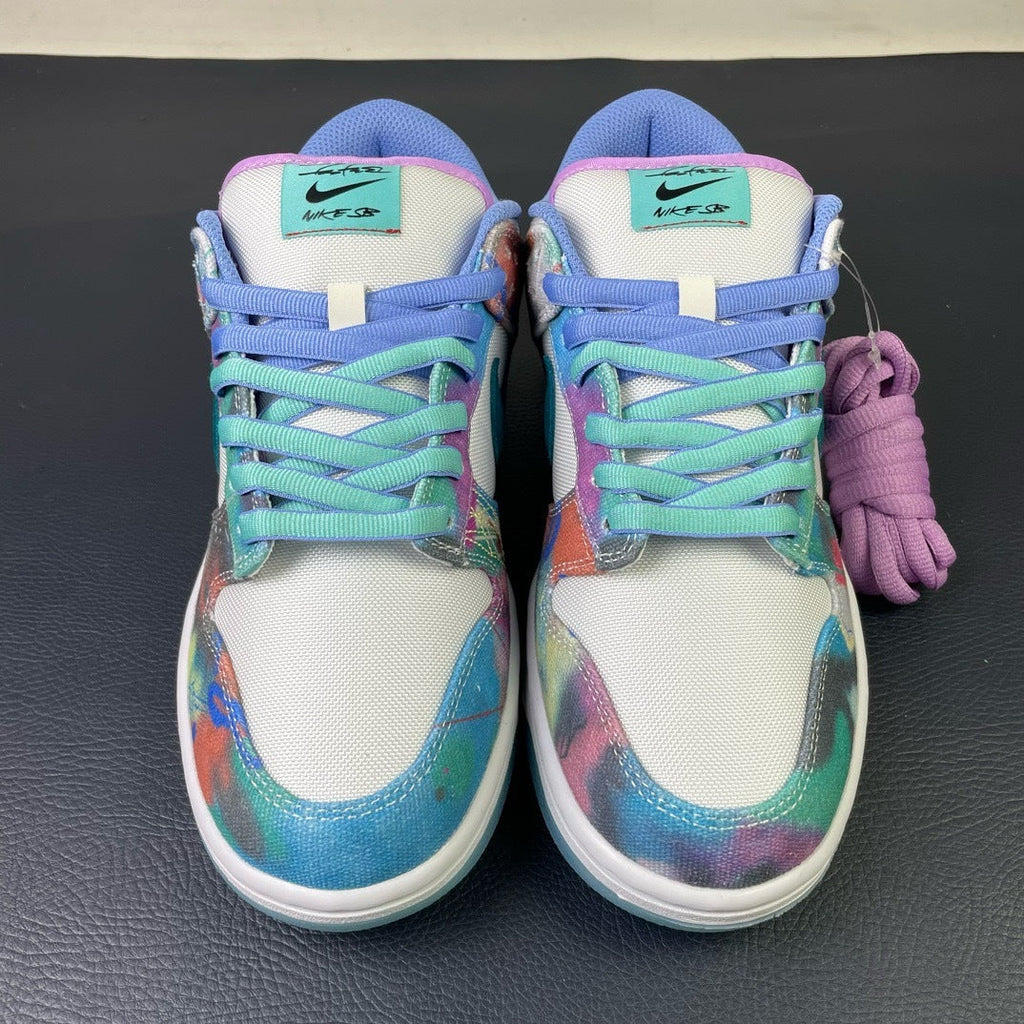 Nike SB Dunk Low Futura Laboratories - toe view pair showing teal NIKE SB tongue label and multicolor canvas