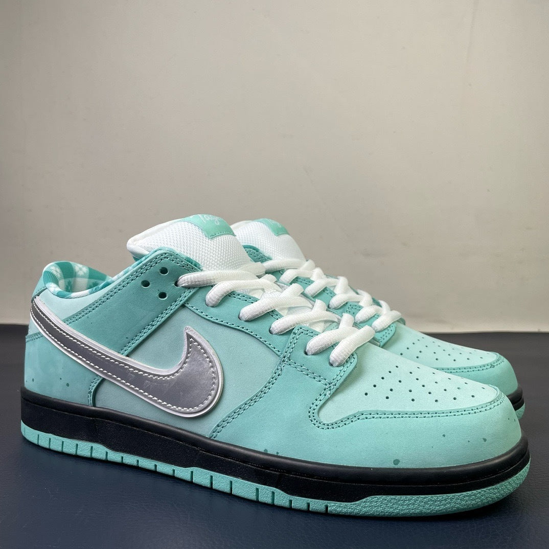 Nike SB Dunk Low x Tagz Teal - Side angle view