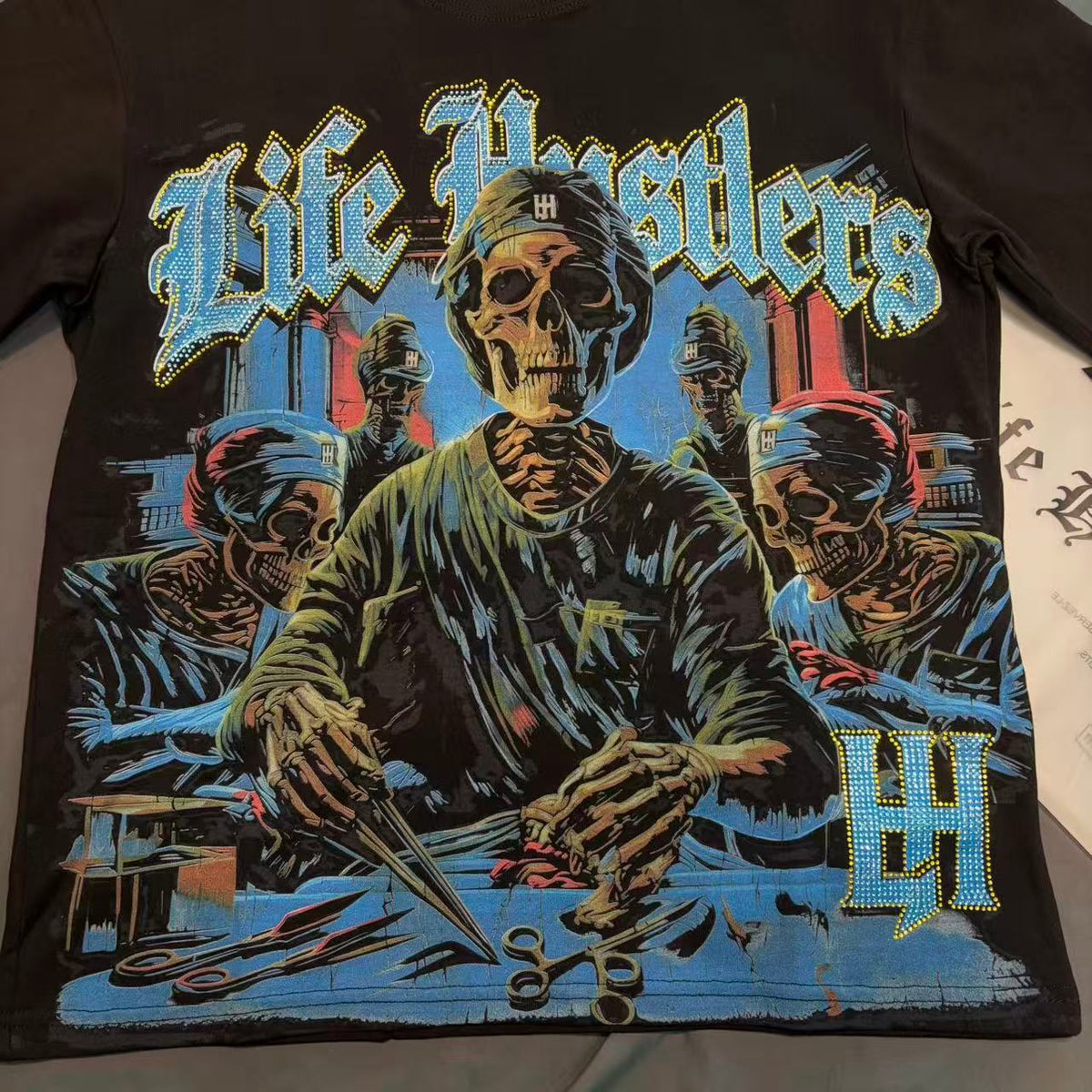Life Hustlers Skeleton Surgeon Graphic Tee