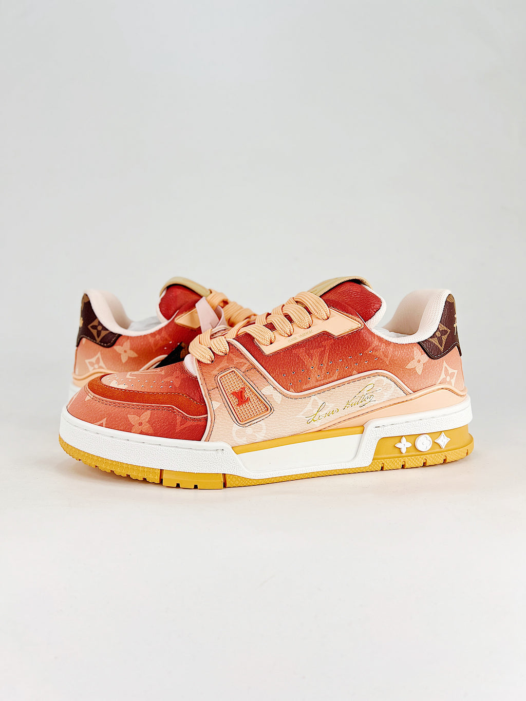 LV Trainer #54 Red Pink Yellow – three-quarter pair view