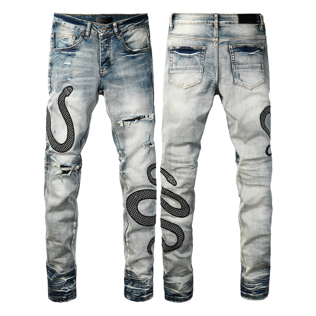 Snake embroidered distressed jeans front view