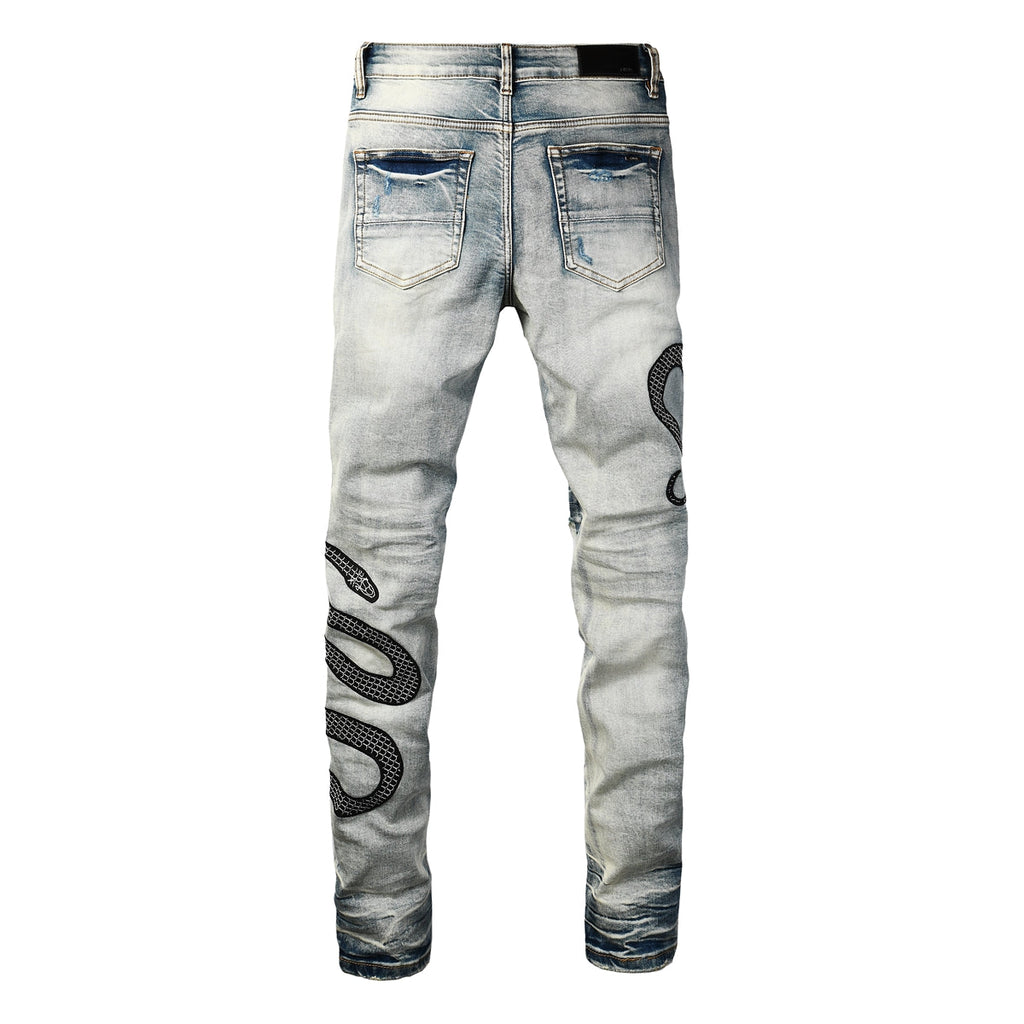 Snake embroidered distressed jeans back view