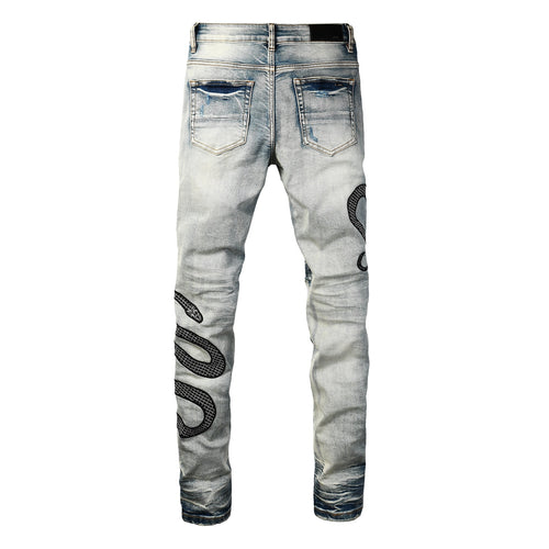 Snake embroidered distressed jeans back view