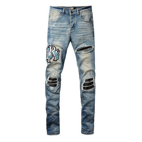 Amiri Dragon Patch Distressed Jeans – leather insert detail