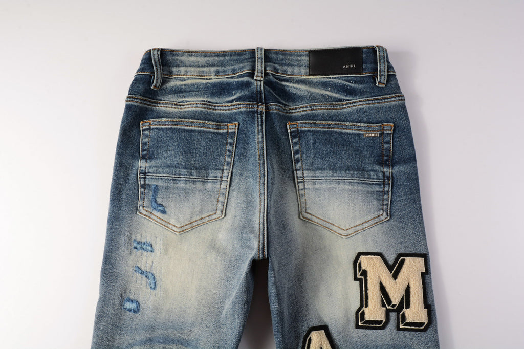 AMIRI MA Varsity Jeans front view full length