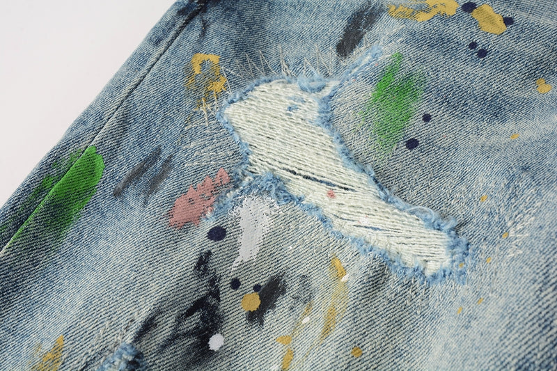 Purple Brand paint splatter and rip detail close-up