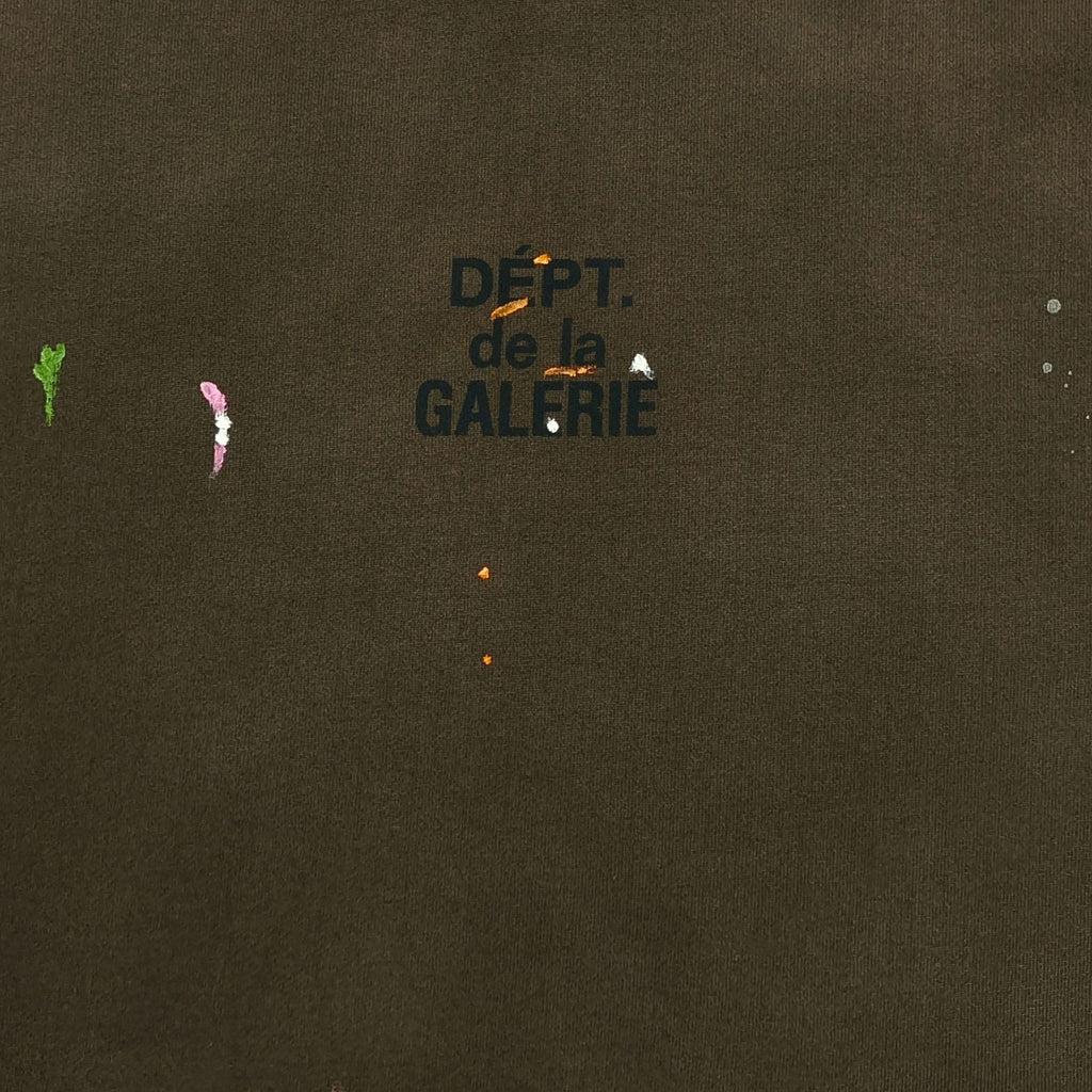 Gallery Dept. Dépt. de la Galerie chest logo detail with paint splatter