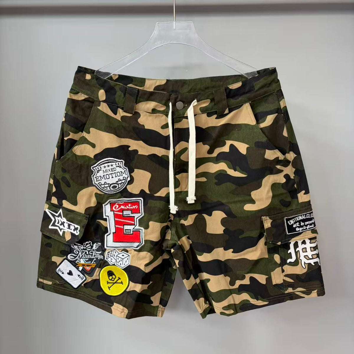 Mixed Emotion Camo Patch Cargo Shorts - front on hanger