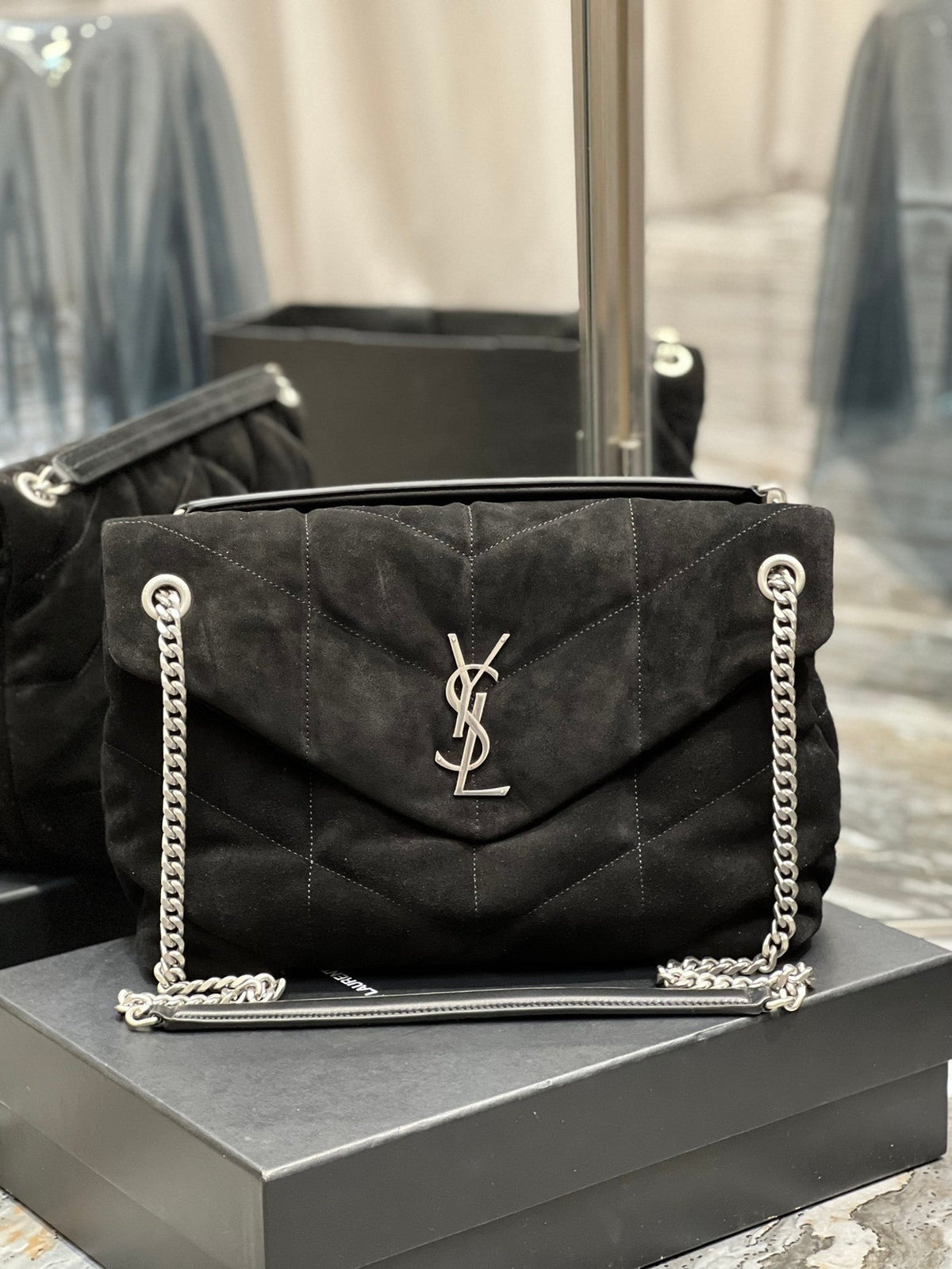 Saint Laurent Loulou Puffer bag front view in black suede with silver hardware