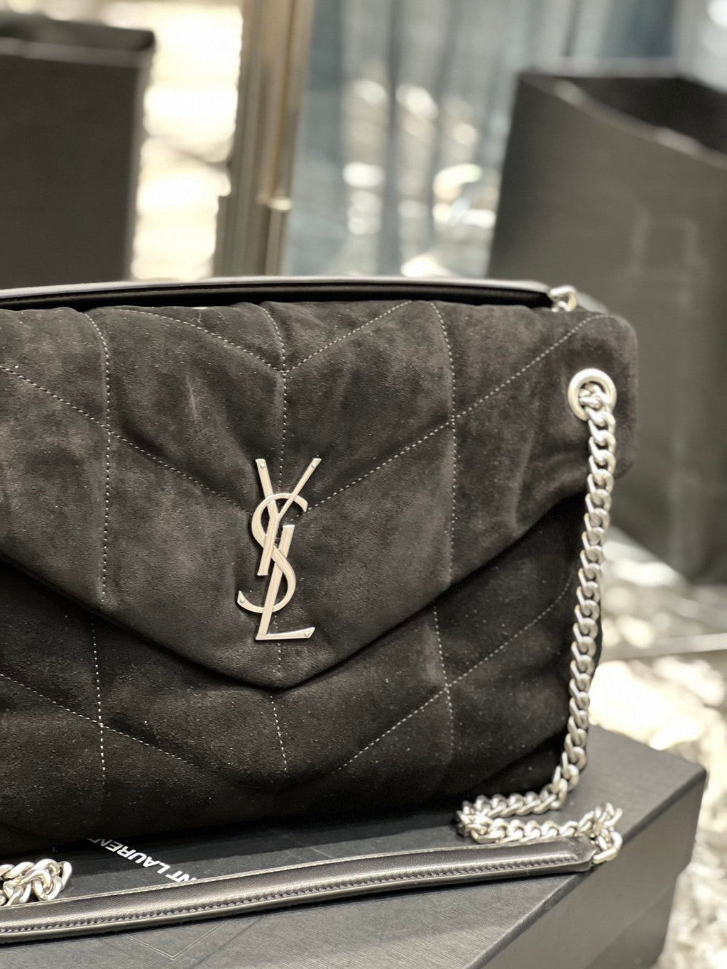 Saint Laurent Loulou Puffer bag full view with chain strap on display