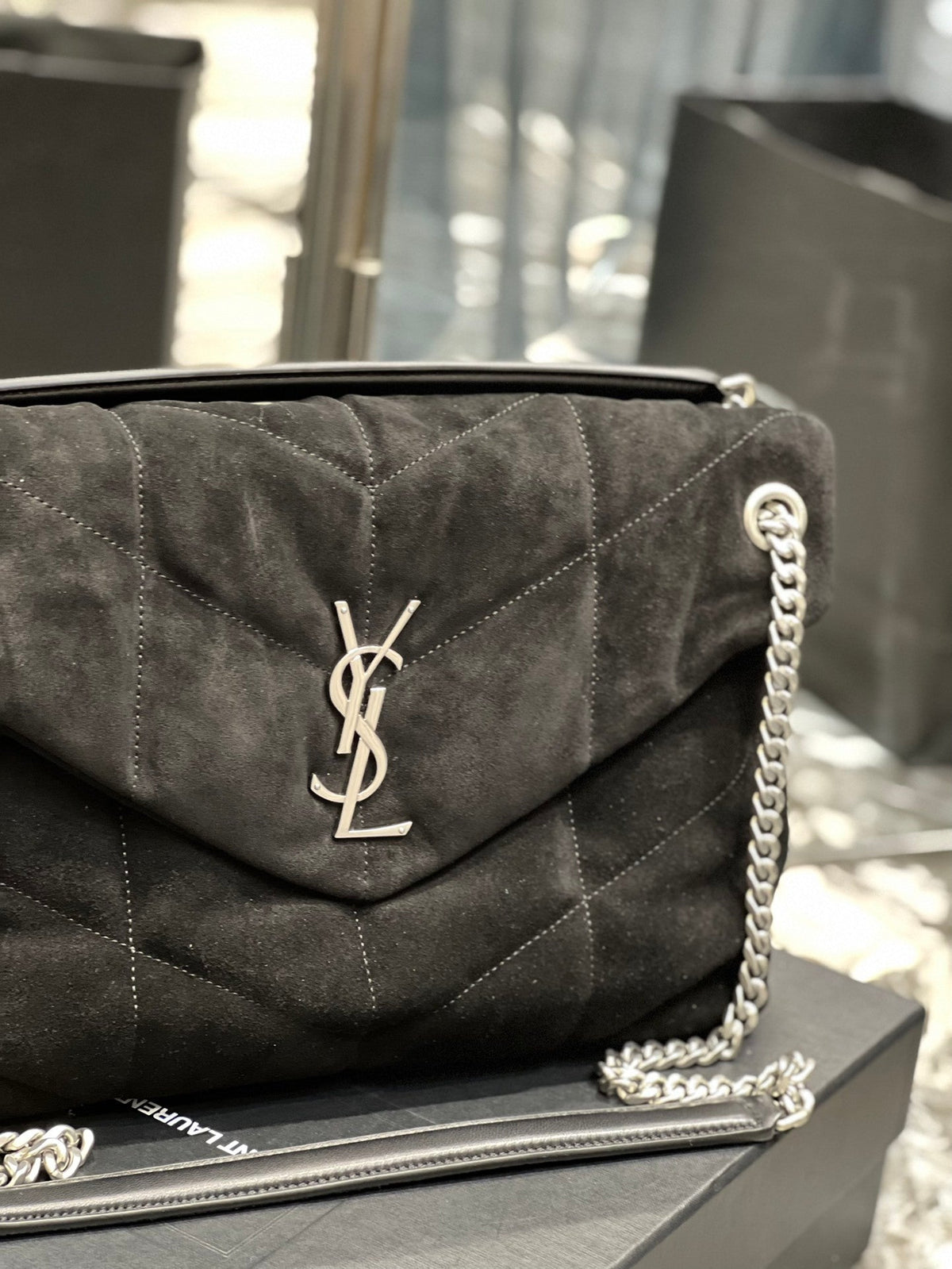 Saint Laurent Loulou Puffer bag full view with chain strap on display