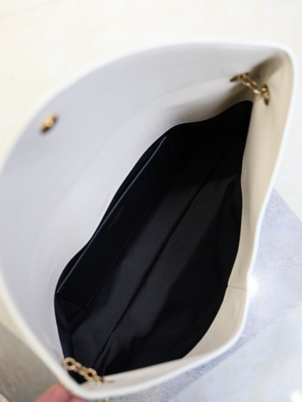 Saint Laurent Cassandra envelope bag interior black lining with flat slip pocket