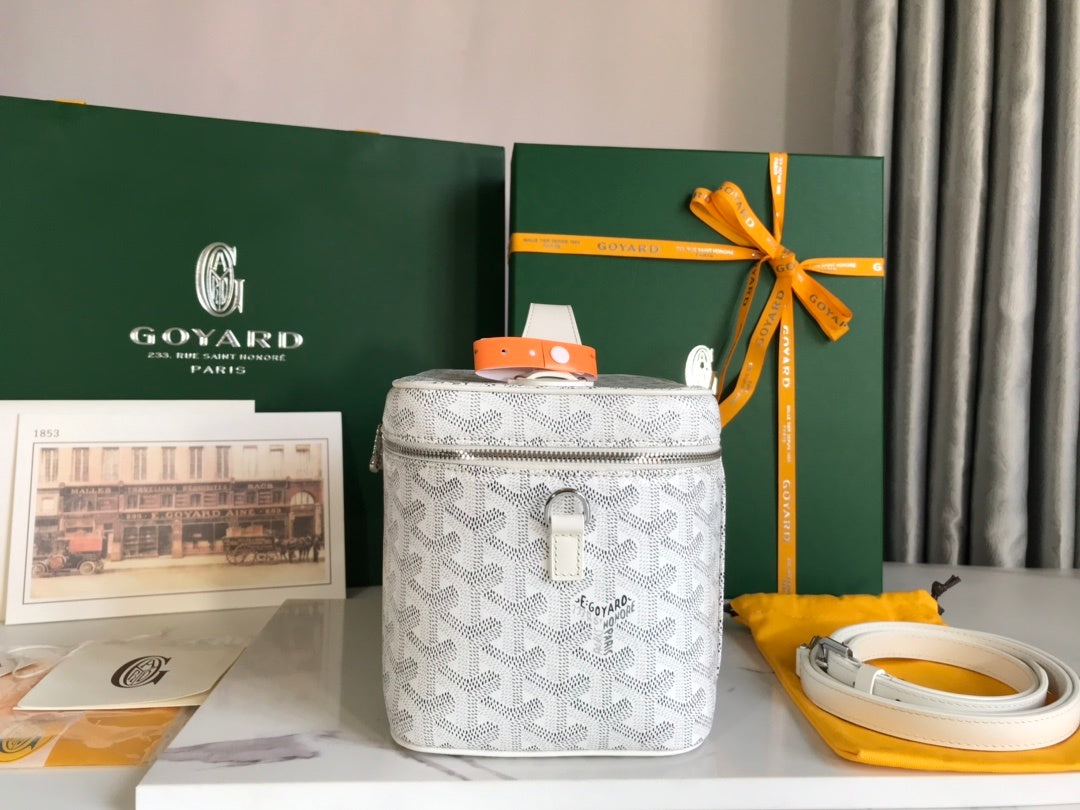Goyard Vanity Case white Goyardine canvas top view with orange handle detail and full packaging