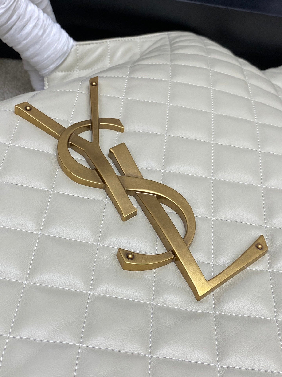 Saint Laurent Icare Maxi bag oversized YSL aged gold monogram hardware close-up
