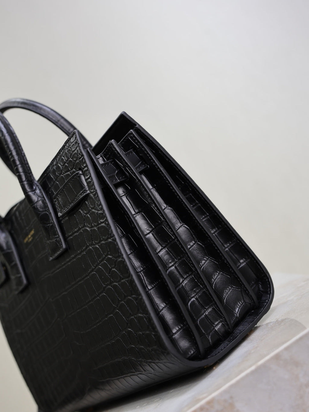 Saint Laurent Sac de Jour small black croc interior accordion dividers close-up
