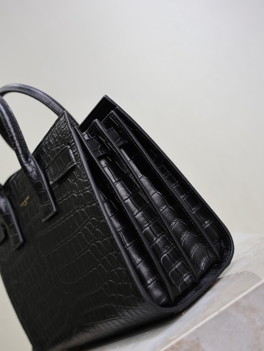 Saint Laurent Sac de Jour small black croc interior accordion dividers close-up