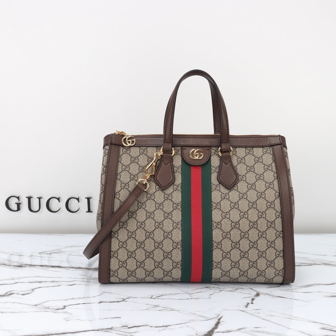 Gucci Ophidia GG medium tote front view with Web stripe and Double G hardware
