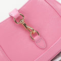 Gucci Jackie 1961 mini bag gold piston closure close-up