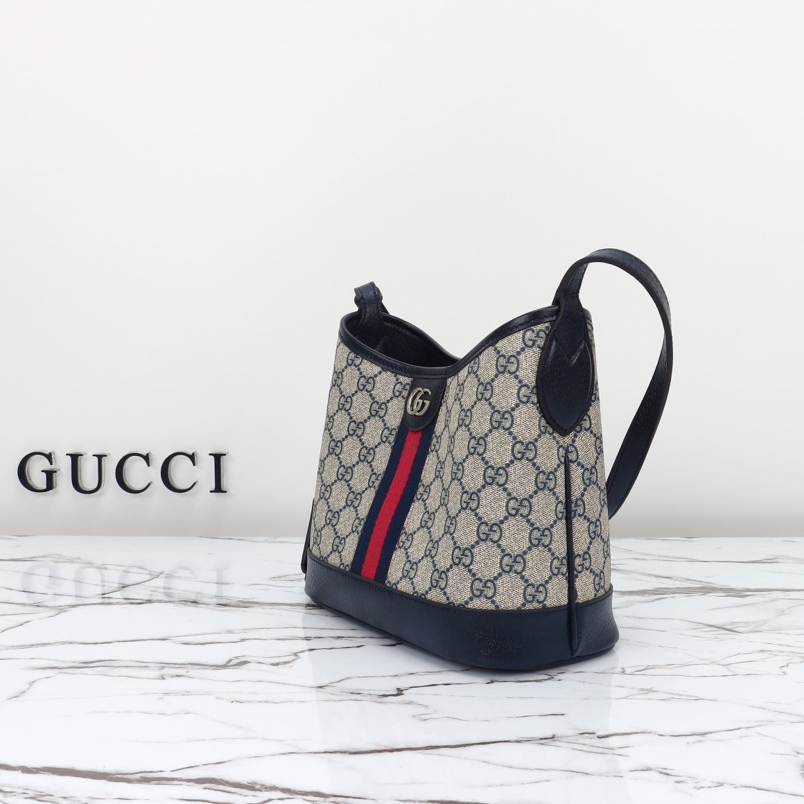 Gucci Ophidia bucket bag GG clasp and Web stripe close-up
