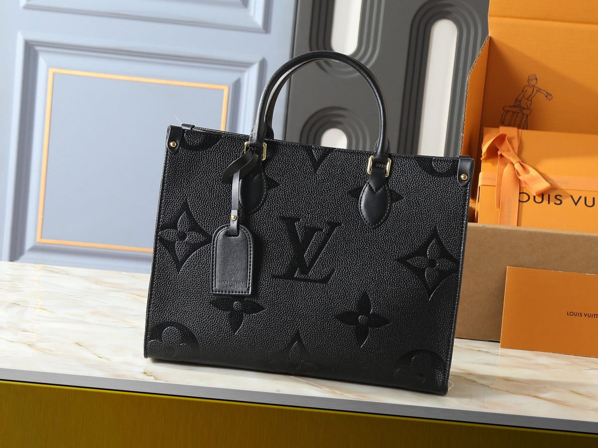 Louis Vuitton OnTheGo GM Black Empreinte – Front View with Luggage Tag
