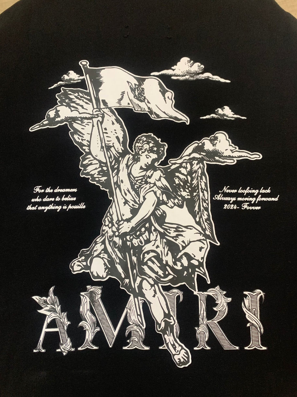 Amiri Angel Hoodie – Back graphic close-up with angel, clouds, and inspirational text