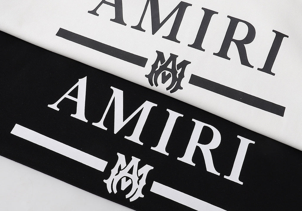 Amiri MA Bar Logo Hoodie – Logo close-up Black and White side by side