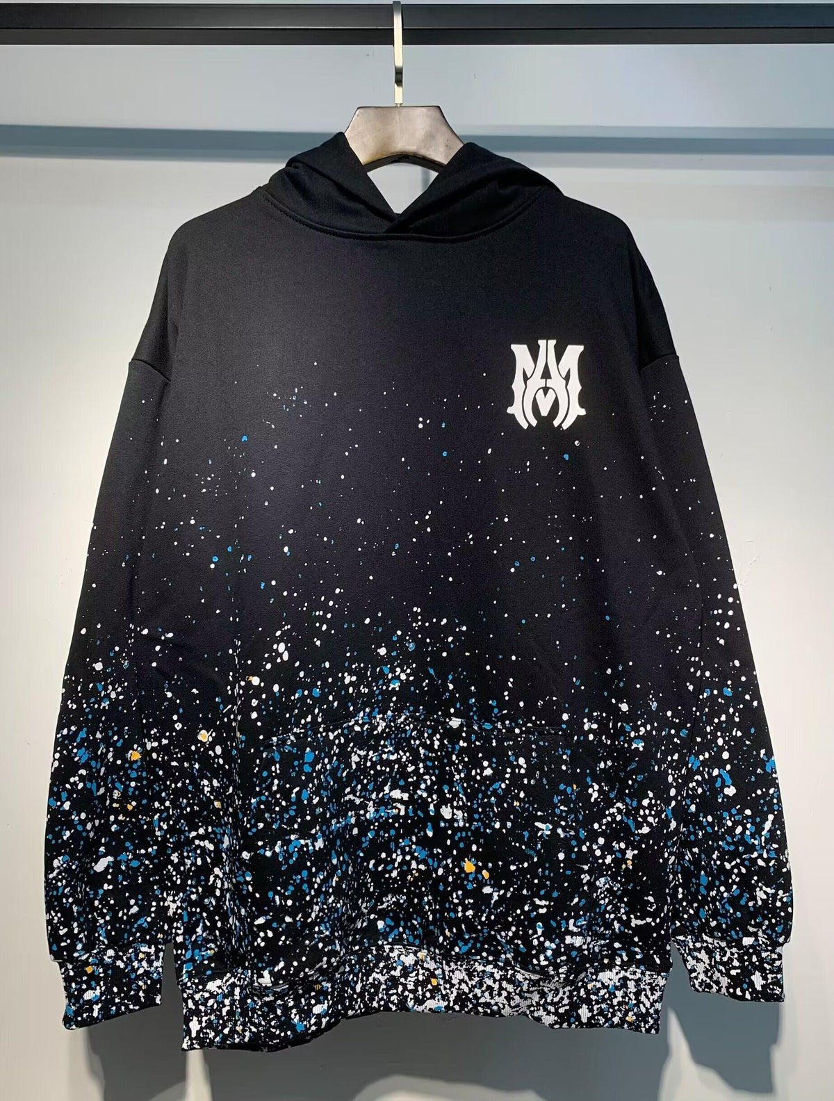 Amiri Paint Splatter Hoodie – Black chest MA monogram close-up