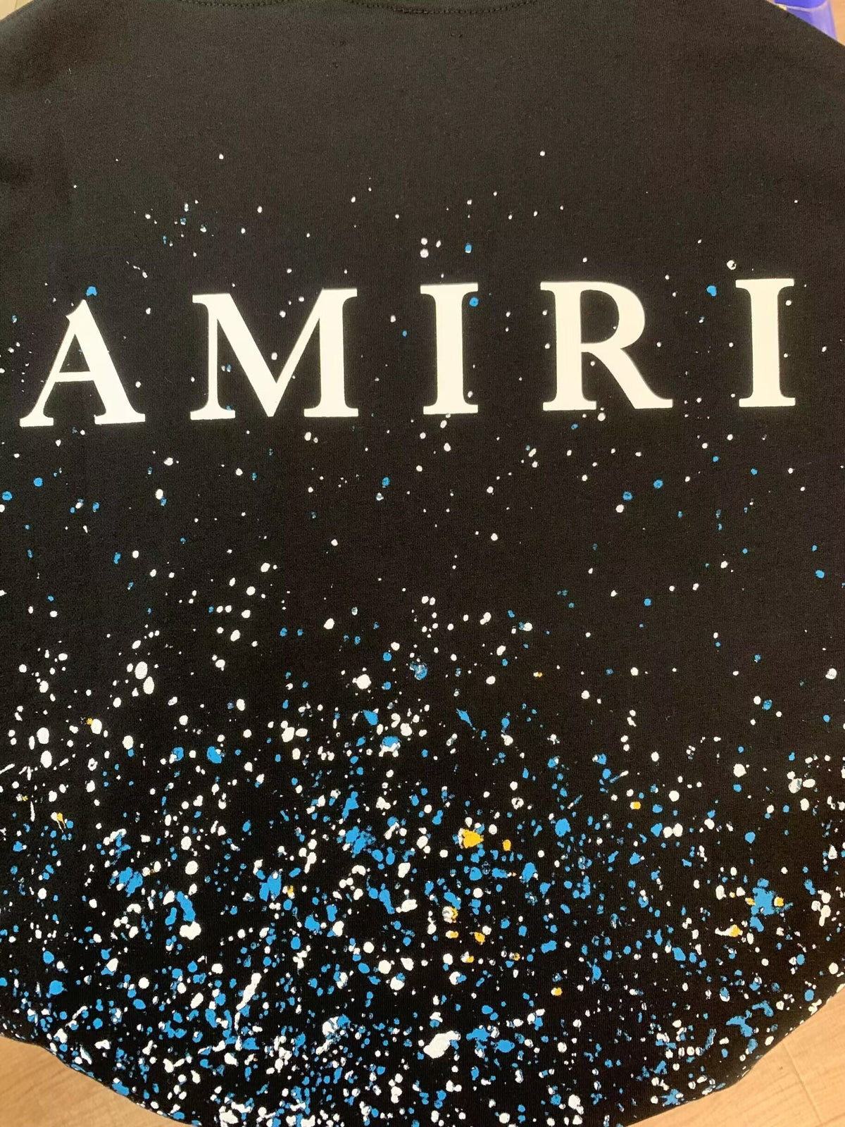 Amiri Paint Splatter Hoodie – Black back AMIRI lettering close-up with splatter detail