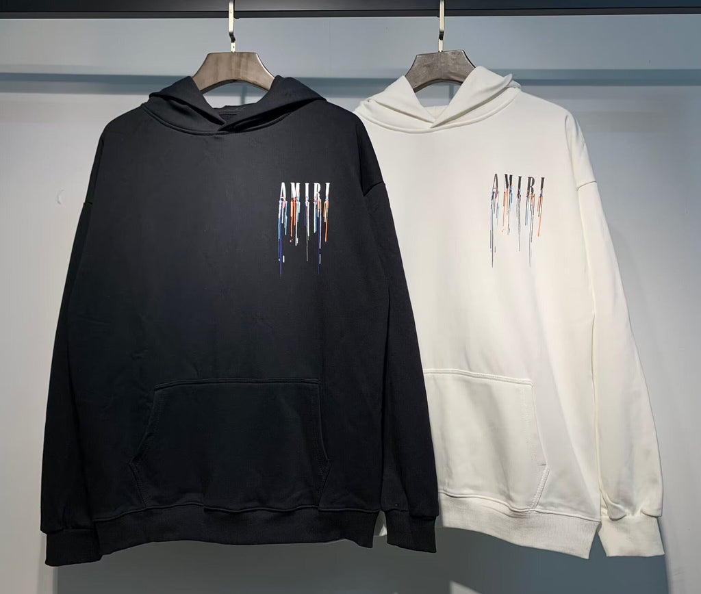 Amiri Paint Drip Hoodie – Black and Cream front logo detail