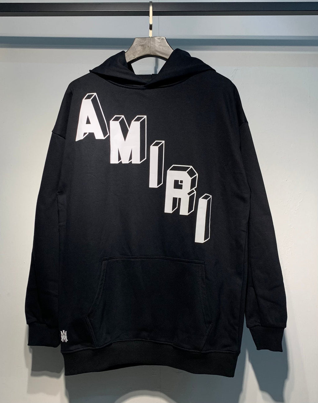 Amiri 3D Logo Hoodie – Black and White close-up logo detail
