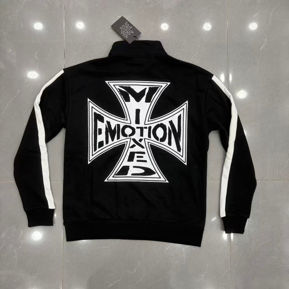 Mixed Emotion black sweatpants front view with cross graphic on thigh