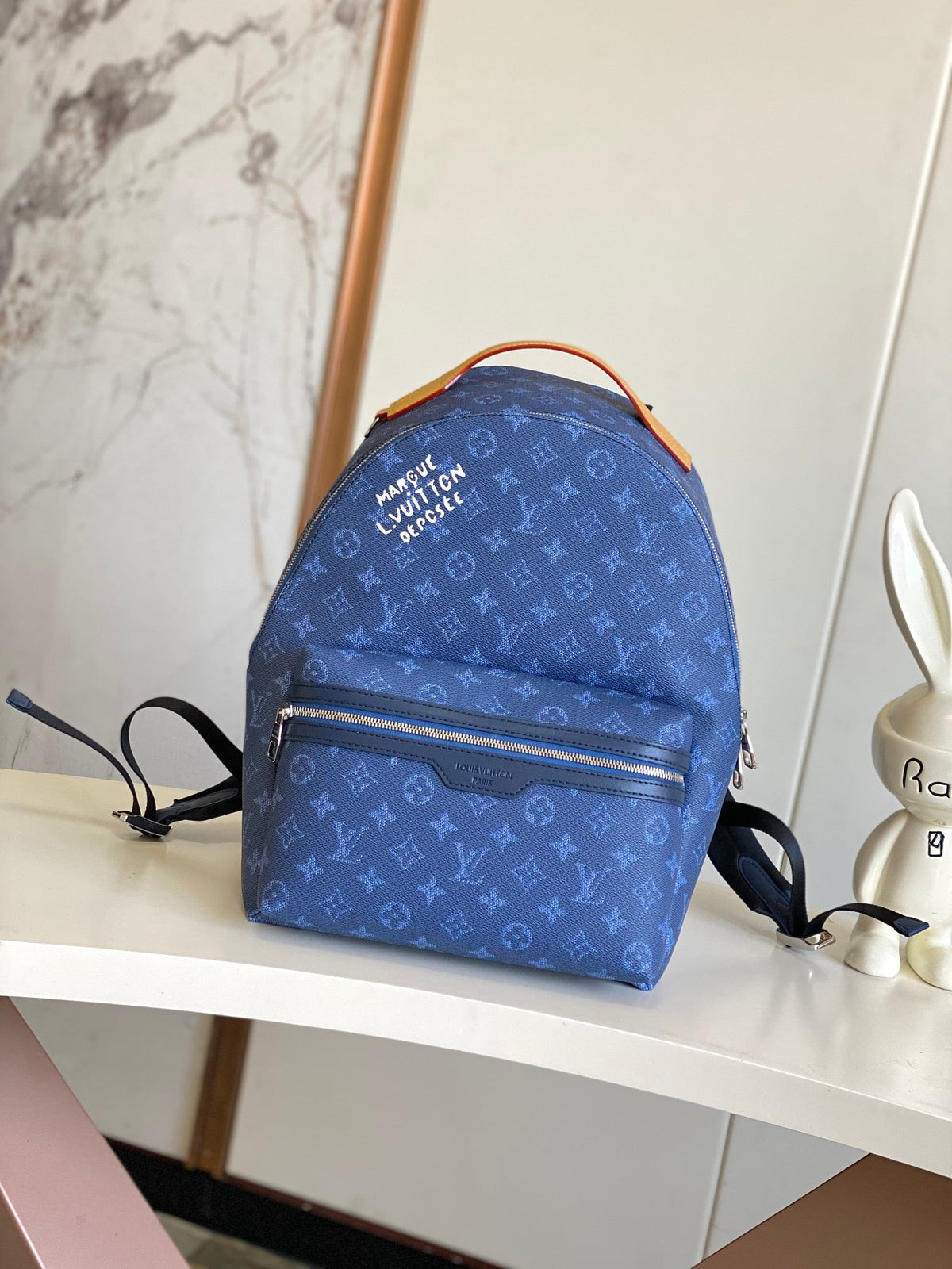 Louis Vuitton Discovery Backpack PM - Gold LV buckle hardware detail