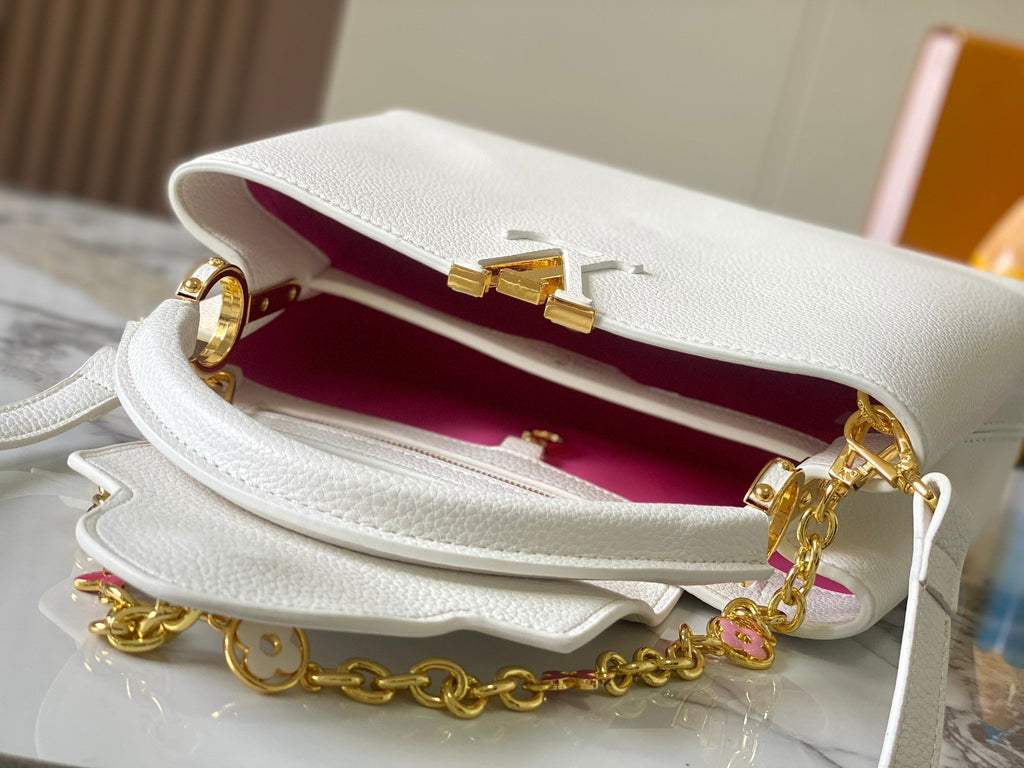 Louis Vuitton LV initials gold-tone clasp close-up