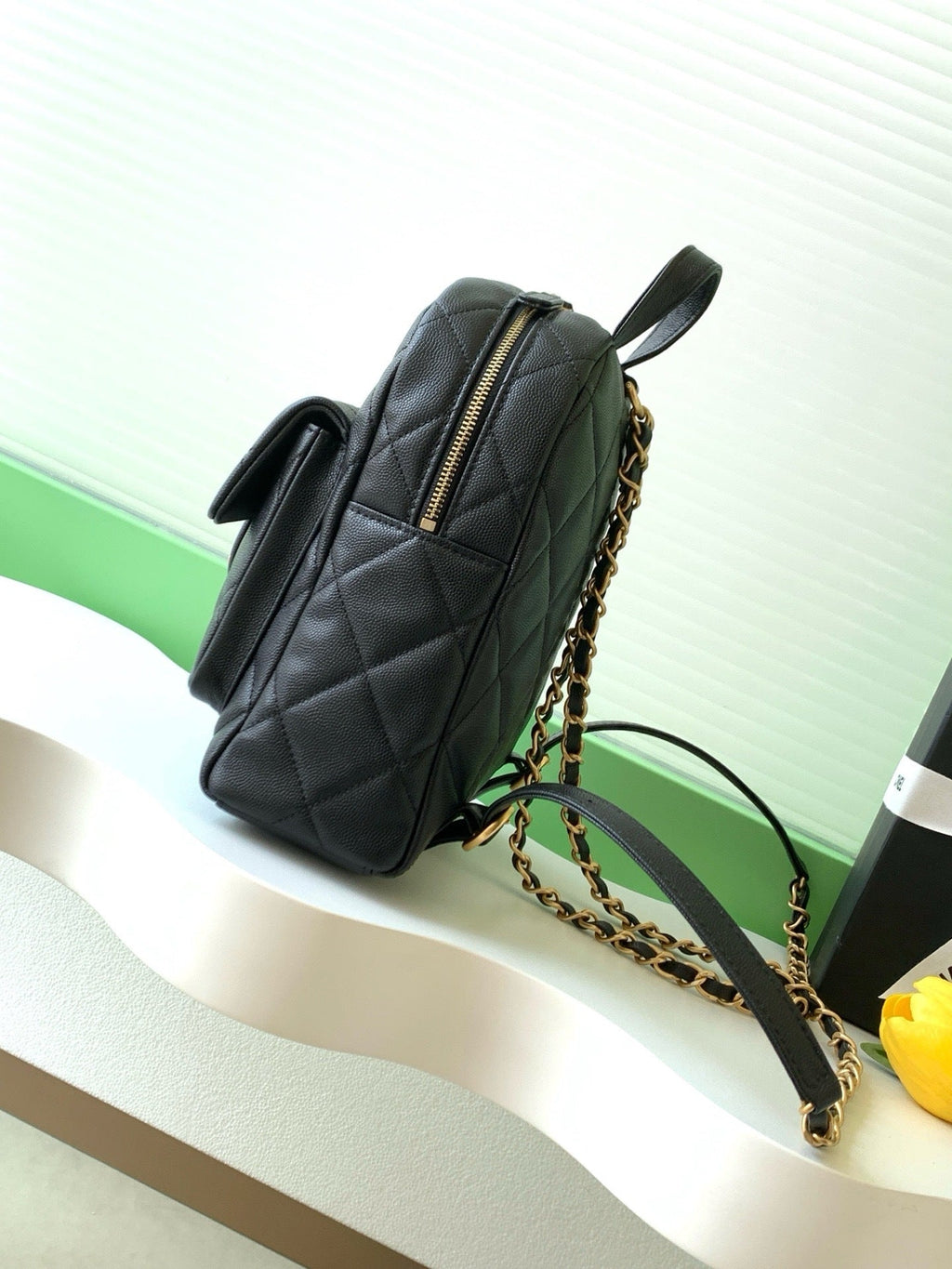 Chanel mini backpack front view with CC logo clasp