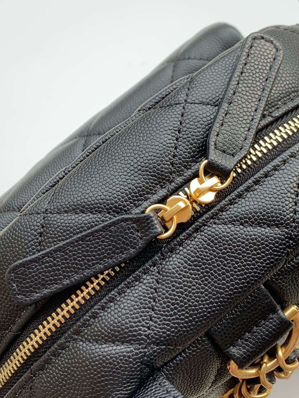 Chanel mini backpack side view with chain straps