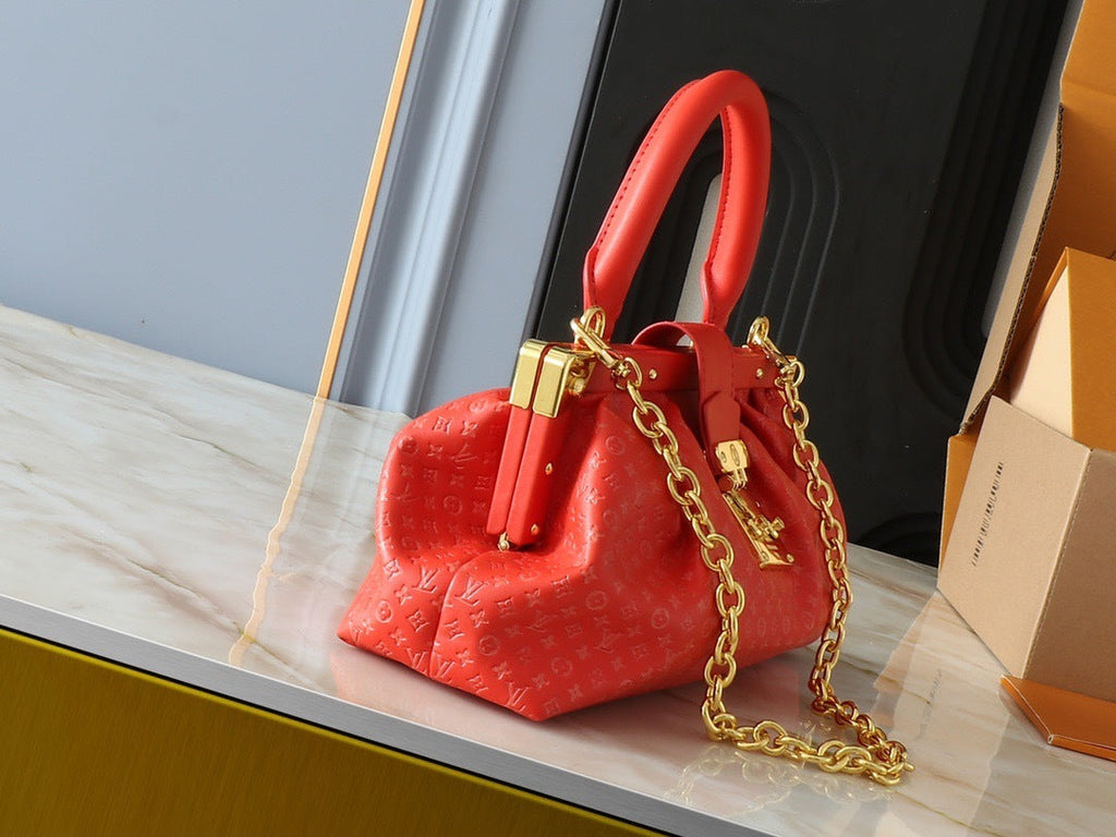 Louis Vuitton red monogram clutch with gold chain strap – front view