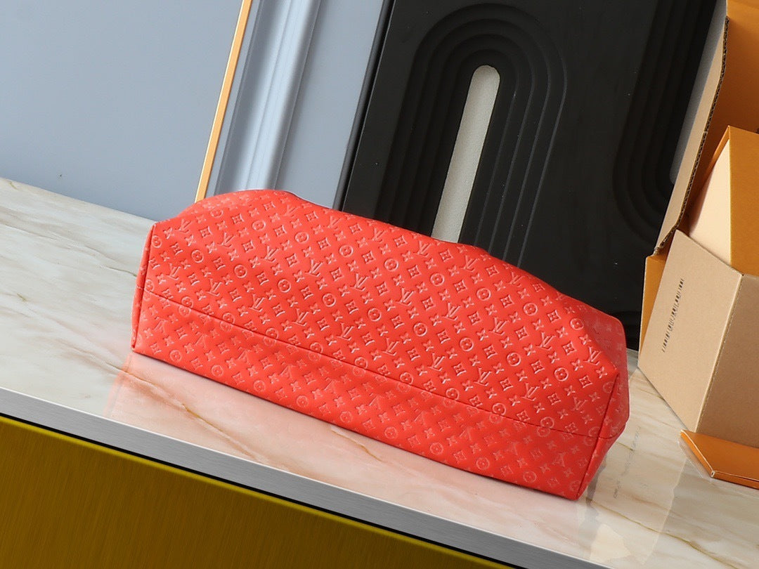 Louis Vuitton red clutch open interior view – pink lining and gold frame