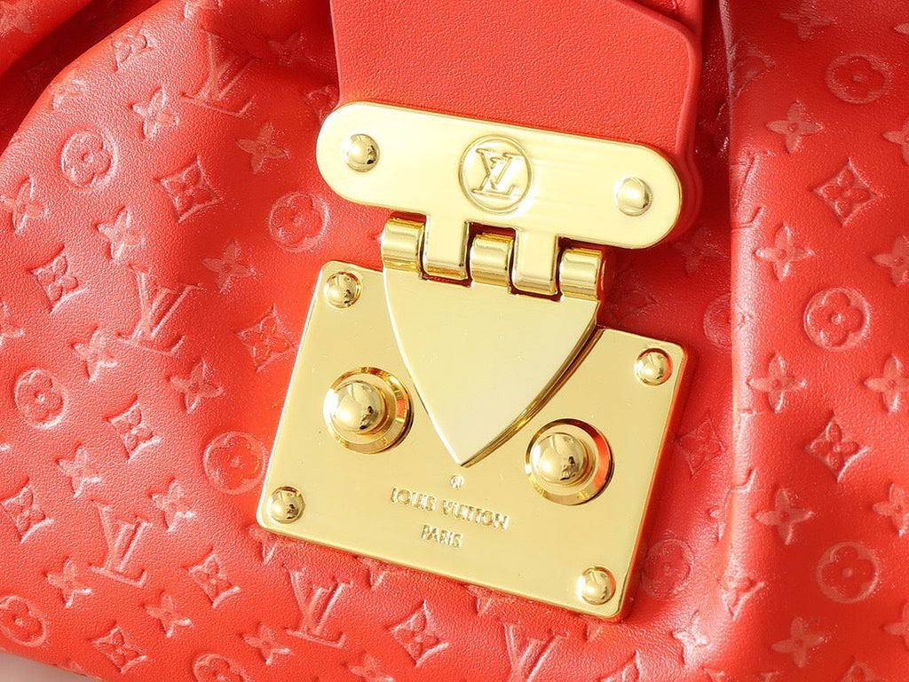 Louis Vuitton red monogram clutch – top handle view