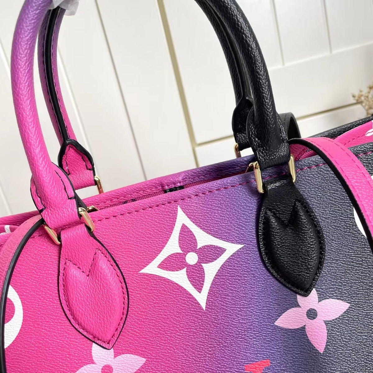 LV OnTheGo MM Midnight Fuchsia - side angle view
