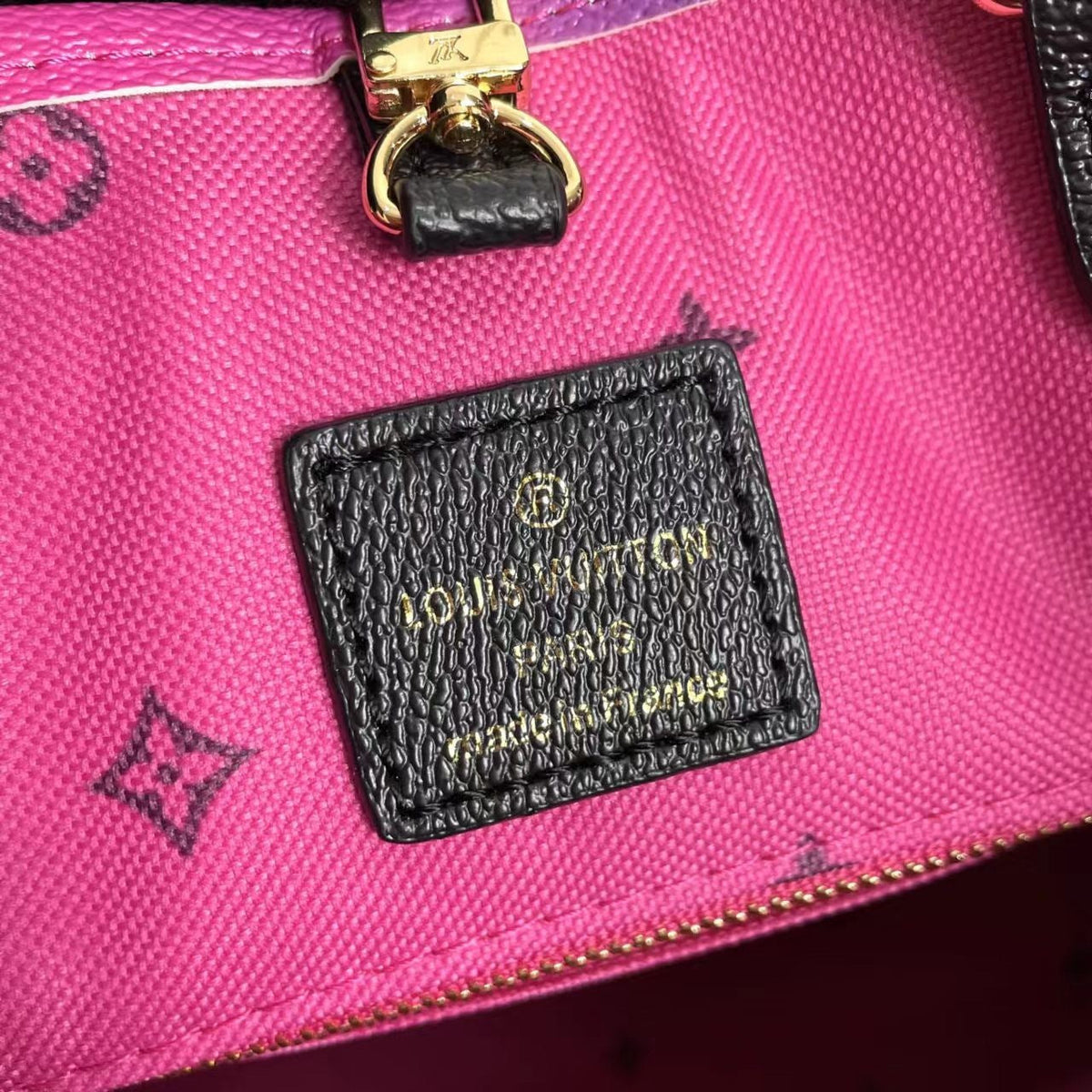 LV OnTheGo MM Midnight Fuchsia - three-quarter view