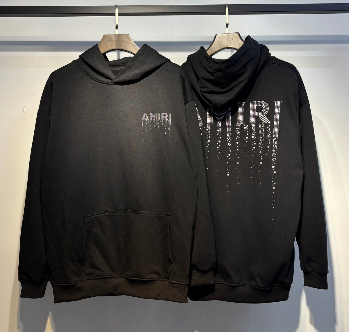 Amiri Crystal Drip Hoodie – front and back view in black with rhinestone logo