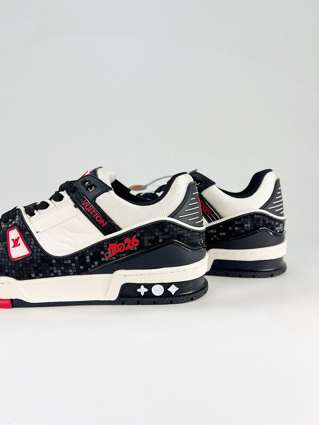 LV Trainer #54 Black White CNY – three-quarter view with horse charm