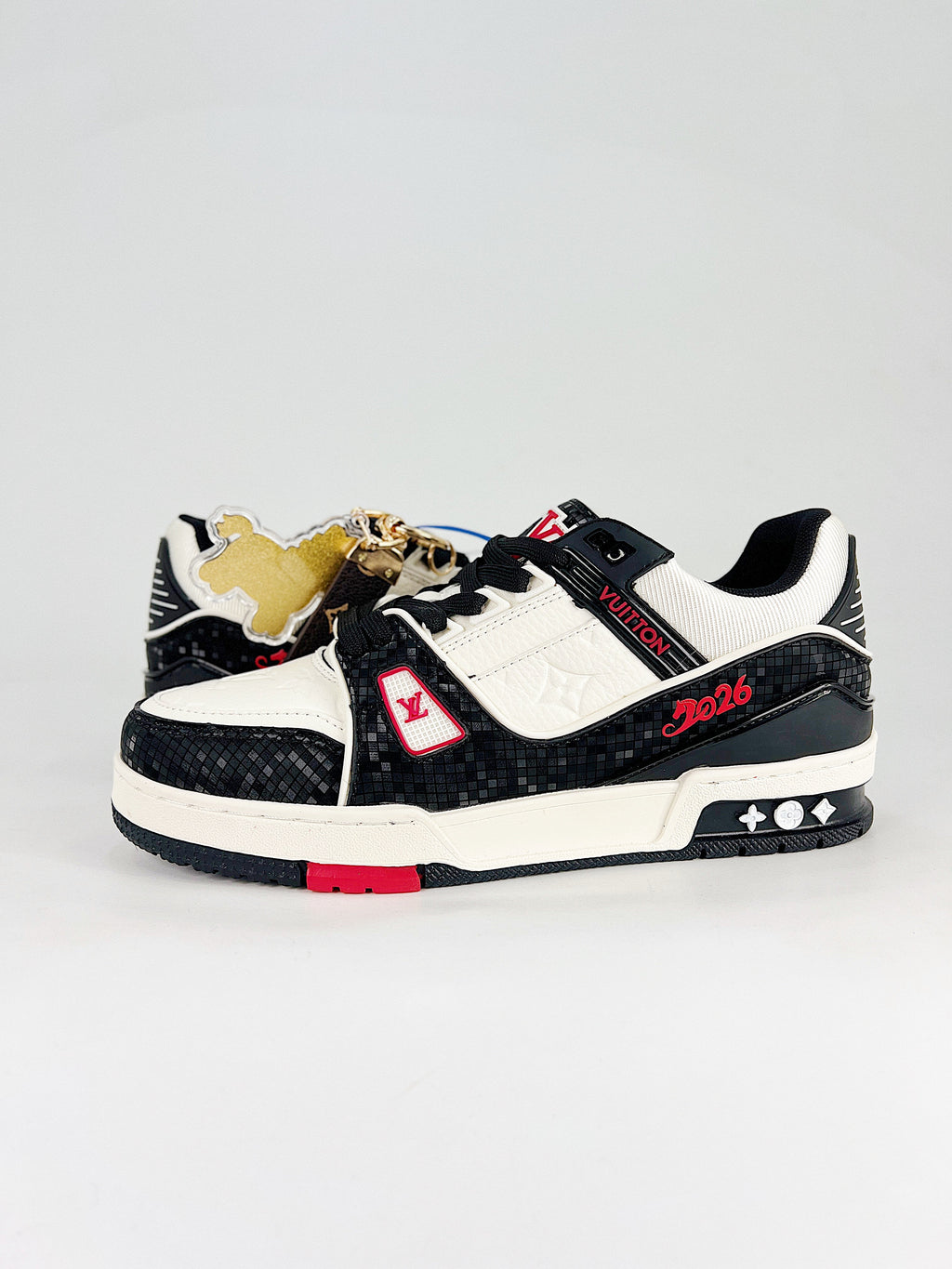 LV Trainer #54 Black White CNY – side view with horse charm